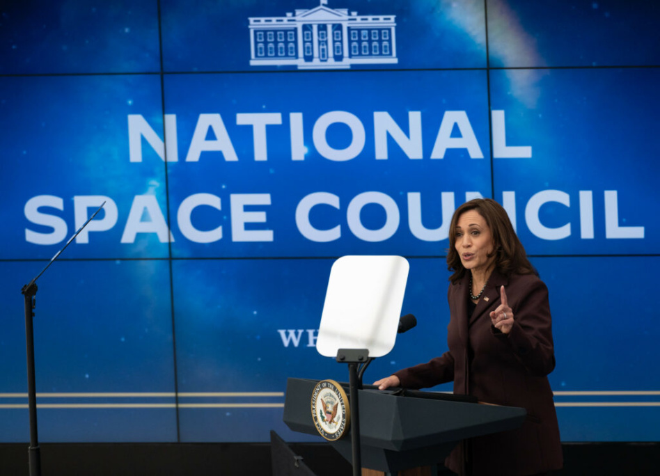 Vice President Kamala Harris in front of a National Space Council sign