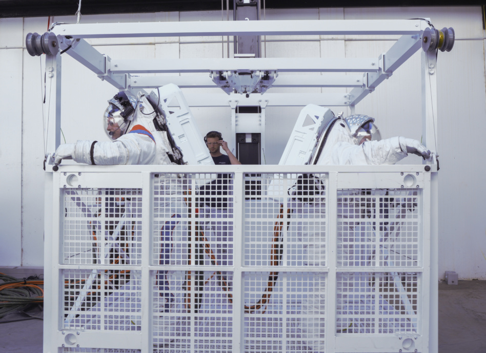 Axiom's AxEMU suit is tested inside a mock-up of the elevator for SpaceX's Starship Human Landing System. Image: Axiom Space.