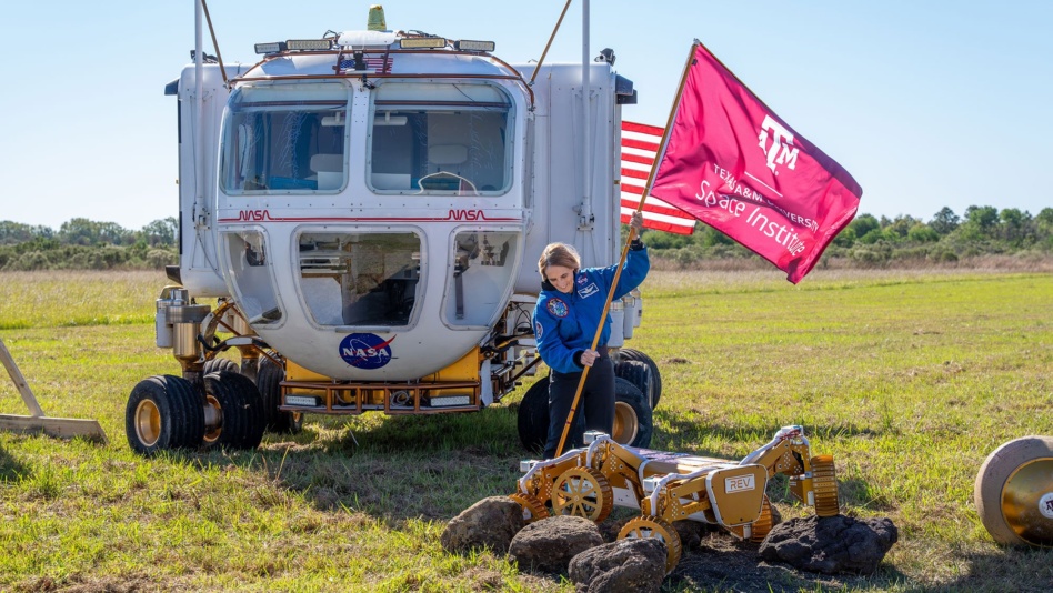 Texas A&M University Space Institute Director Dr. Nancy Currie-Gregg plants a flag for the new institute during a groundbreaking ceremony. Image: Texas A&M College of Engineering