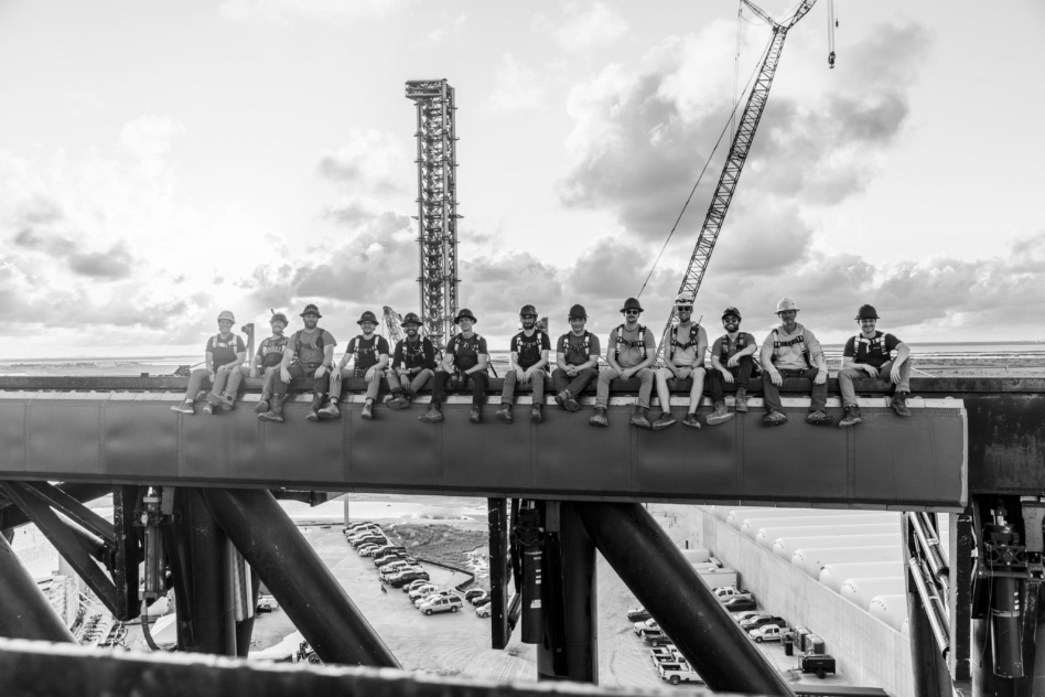 SpaceX workers photographed on the Starship launch and recovery tower. Image: SpaceX.