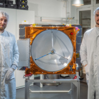 Reflex cofounders Walter Ballheimer and Alexander Genzel with the company's first satellite, SIGI. Image: Reflex Aerospace